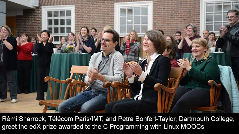Rémi Sharrock, Télécom Paris/IMT, and Petra Bonfert-Taylor, Dartmouth College, greet the edX prize awarded to the C Programming with Linux MOOCs